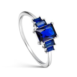 Rhodium-plated silver and emerald-cut blue zirconia ring...