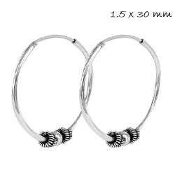 Silver 30 mm Balinese hoop earring with oxidized central...